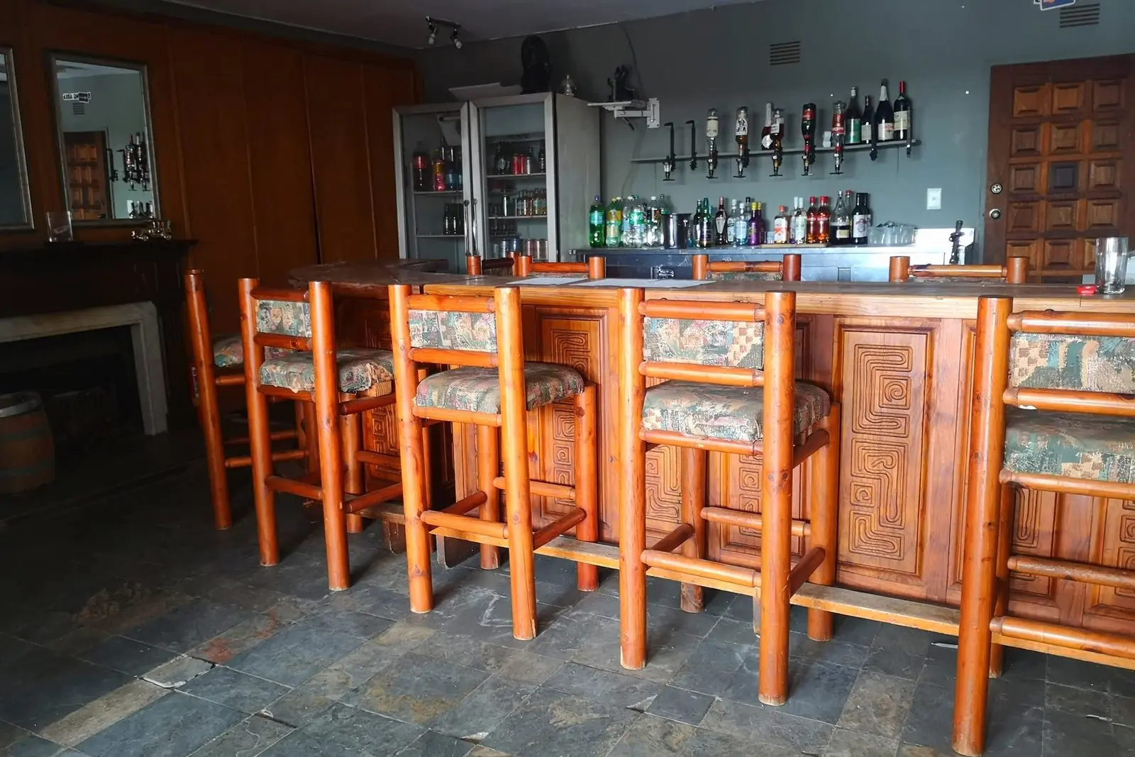 The timber bar counter and stools in the lounge