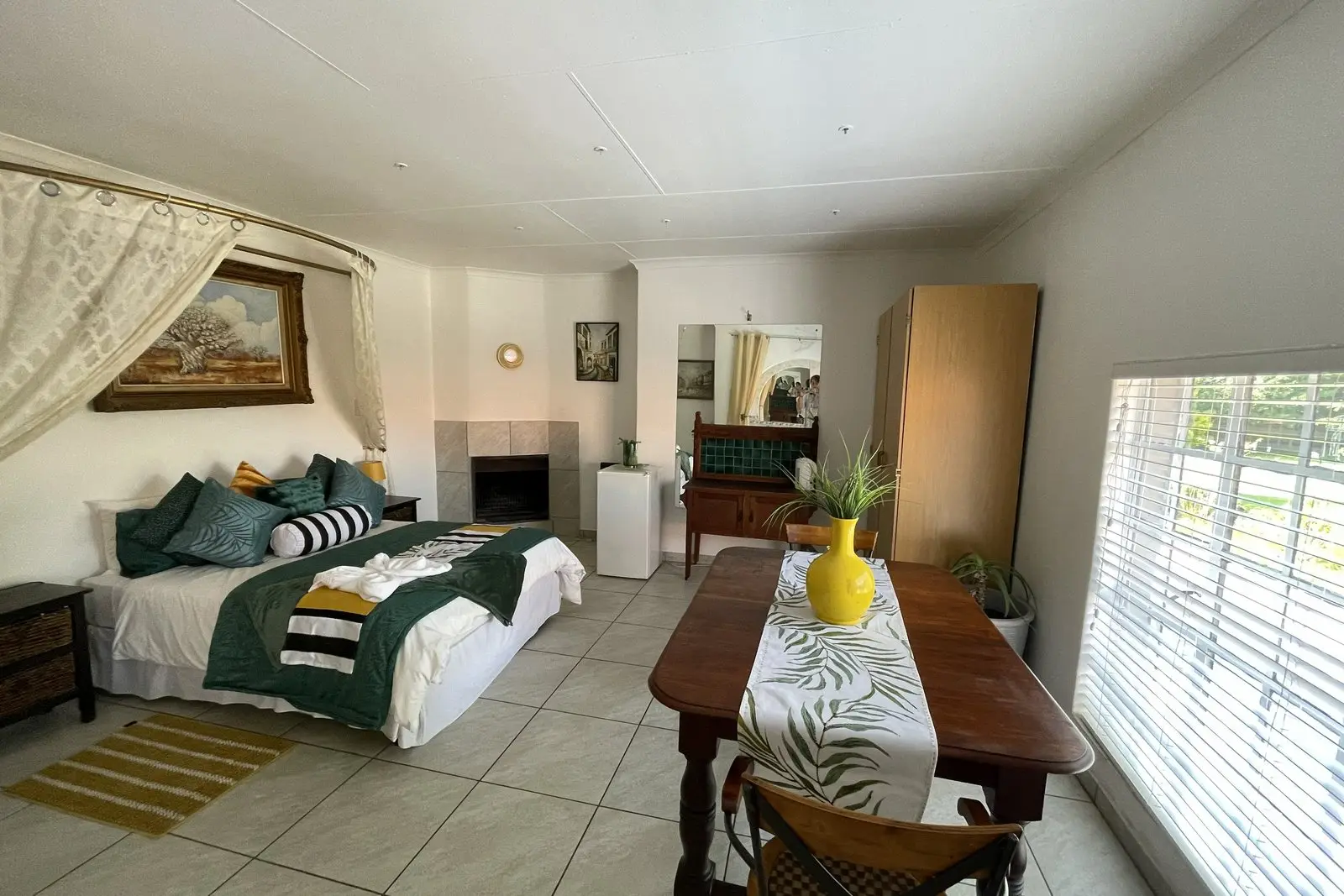 The sitting area of the Honeymoon Suite, with a table and chairs